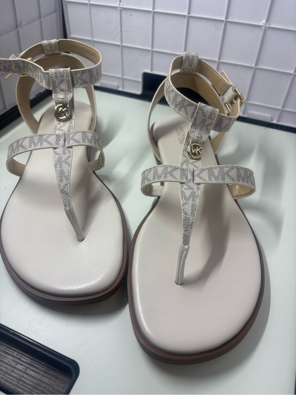 Michael Kors 11 cream/tan MK Logo T-Strap Sandals with Gold Accent